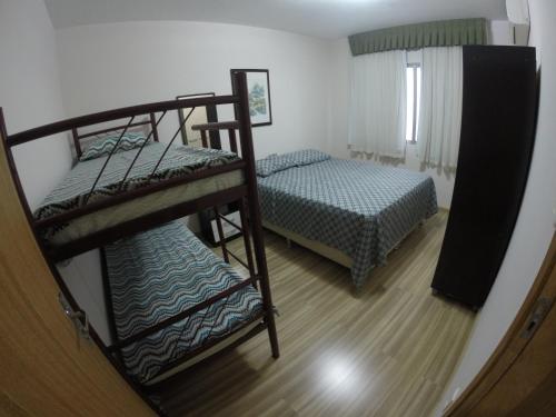 En eller flere senge i et værelse på Casa Área Central