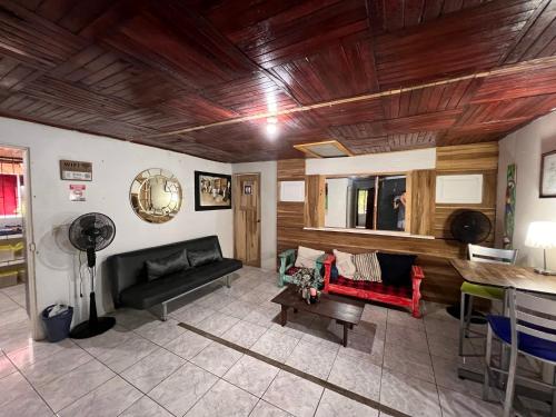 a living room with two couches and a table at Rio Danta in Fortuna