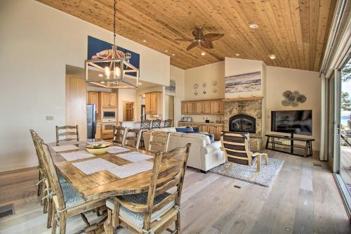 a dining room and living room with a table and chairs at Oceanfront Point Arena House with Lovely Deck! in Point Arena