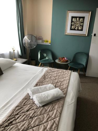 Ένα ή περισσότερα κρεβάτια σε δωμάτιο στο Brighton Surf Guest House