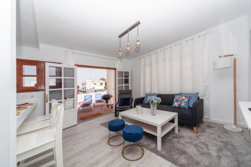 a living room with a couch and a table at Luxury Beach Fayna in Playa Honda