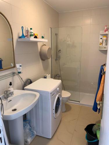 a bathroom with a sink and a toilet and a shower at Clarissa Apartment in Costa de Antigua