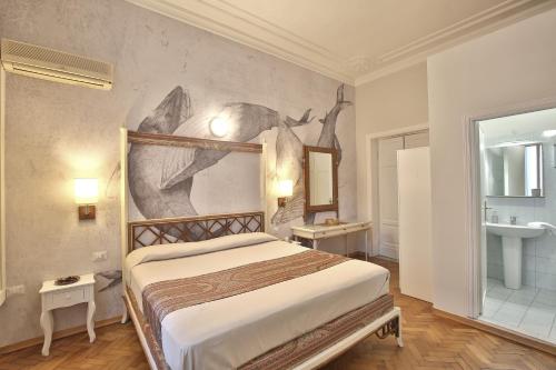 Posteľ alebo postele v izbe v ubytovaní MADAMA GUEST HOUSE