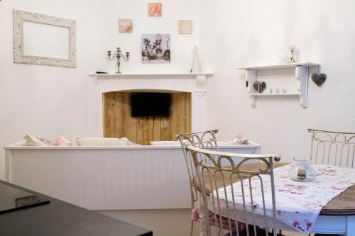 a dining room with a table and two chairs at L'hôtel de Police - Topdestination-Spa in Spa