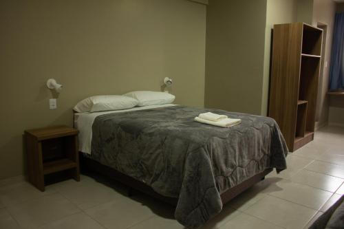 Postel nebo postele na pokoji v ubytování Hotel Executivo