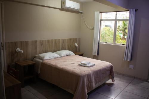Postel nebo postele na pokoji v ubytování Hotel Executivo