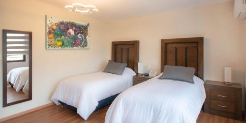 Postel nebo postele na pokoji v ubytování Hotel Posada XR