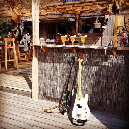 a couple of guitars are parked next to a bar at Veela metsamaja in Elbiku