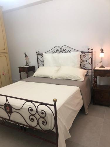 Giường trong phòng chung tại Casa Marisò