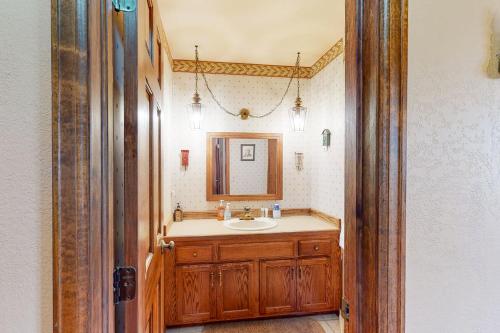 a bathroom with a sink and a mirror at Elk Ridge Retreat #3098 in Estes Park