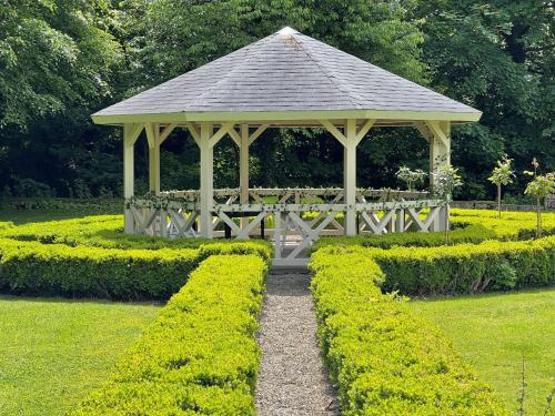 a gazebo in the middle of a garden at Hall Garth Hotel Darlington, Sure Hotel Collection by BW in Darlington