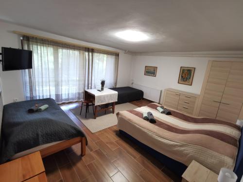 Katil atau katil-katil dalam bilik di Tündéri Családos Apartmanok