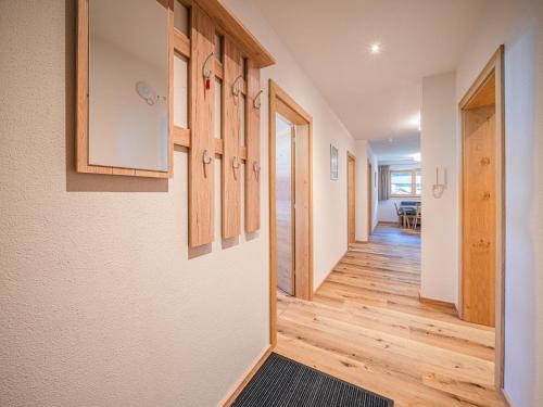 a hallway in a house with wood floors and cabinets at Festenhof in Hopfgarten im Brixental