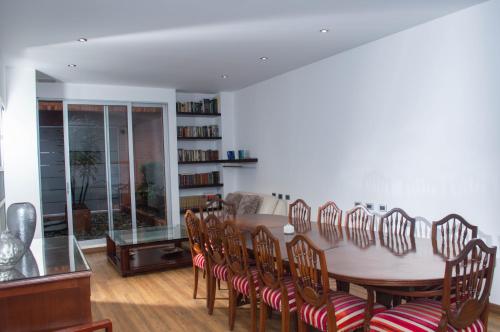 a dining room with a table and chairs at Suites Casa 95 in Bogotá