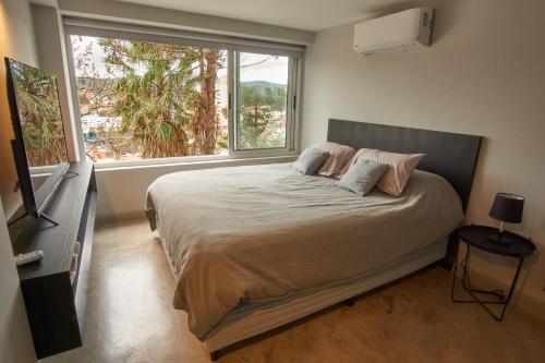 A bed or beds in a room at Barrancas de Nieva B03