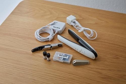 a table with a nintendo wii game controller and other items at MUJI HOTEL GINZA in Tokyo
