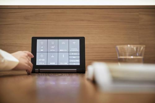 a tablet computer sitting on top of a table at MUJI HOTEL GINZA in Tokyo