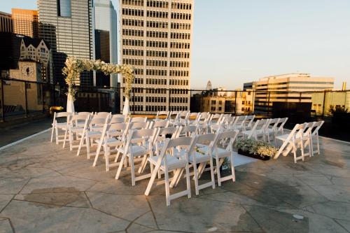 a row of white chairs sitting on top of a building at Los Angeles Athletic Club in Los Angeles