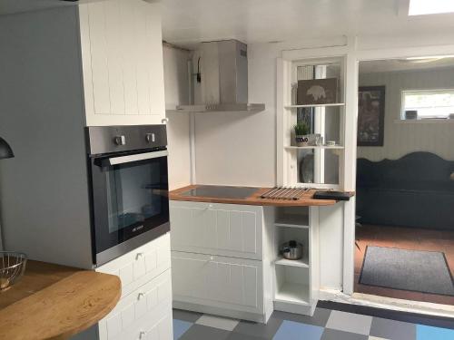 a kitchen with white cabinets and a counter top at 6 person holiday home in Allinge-By Traum in Allinge