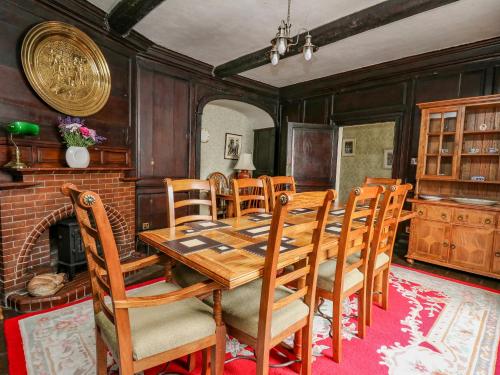 a dining room with a wooden table and chairs at The Laurels in Bishops Castle