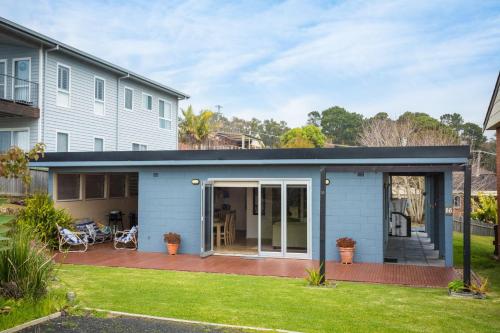 a house with a porch with a patio at Sun Kissed on Dulling in Dalmeny