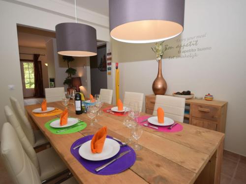 a dining room with a table with food on it at Luxurious Villa in Caldas da Rainha with Swimming Pool in Salir de Matos