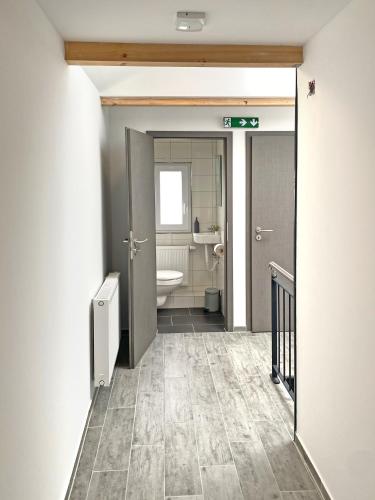 a bathroom with a toilet and a sink at Dock 6 - Cuxhaven in Cuxhaven