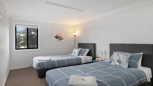 Ένα ή περισσότερα κρεβάτια σε δωμάτιο στο Sutton Forest Retreat Jimmys Homestead