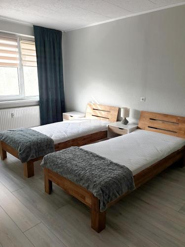 Postel nebo postele na pokoji v ubytování Mazeikiai Apartment