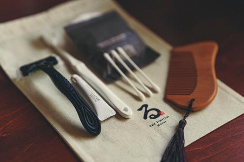 a group of utensils sitting on top of a paper at Kominkayado LOOF Sawanoie in Fuefuki
