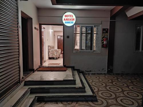 an entrance to a building with a sign that readsrica angel alley at Aakash Rooms and Cottages, in Ooty