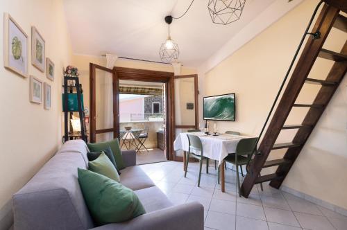 a living room with a couch and a table at Chelubirdi in Villasimius