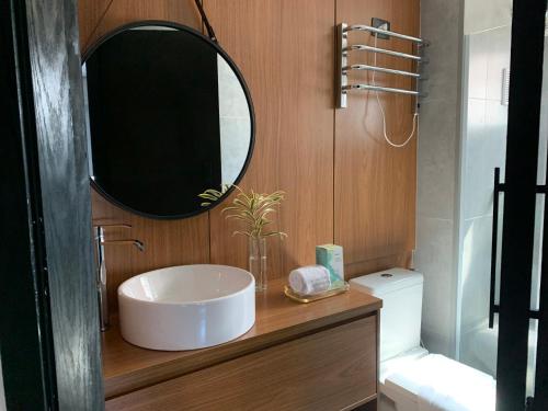 a bathroom with a sink and a mirror at HOTEL SHOPPING VILA OLIMPIA in Sao Paulo