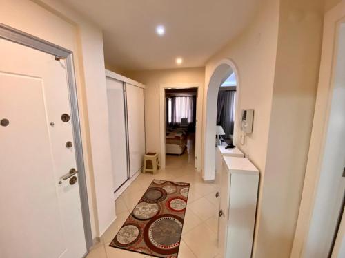 a hallway with a hallway leading to a room at Modern 2bedroom apt on Cleopatra (WiFi,pool) in Alanya