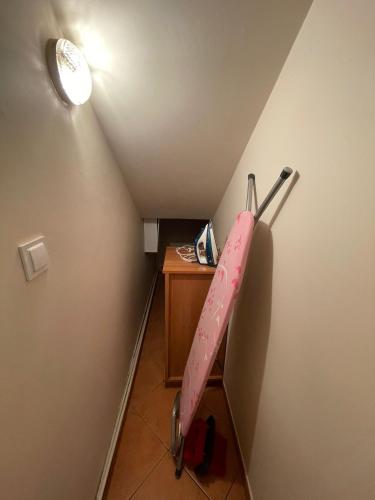 an attic room with a baseball bat on the wall at U Lipińskich - Dom nad jeziorem in Ostrzyce