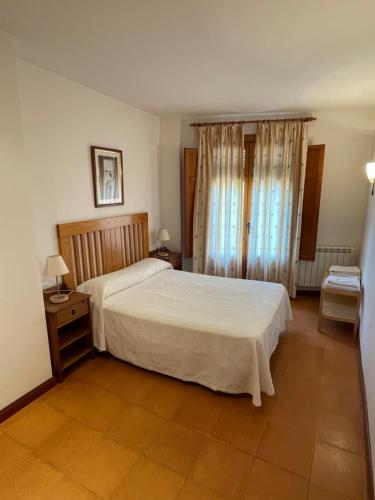 Postel nebo postele na pokoji v ubytování Alojamientos Turísticos Casco Antiguo