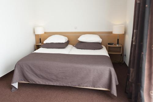 Postel nebo postele na pokoji v ubytování Hotel Ameland
