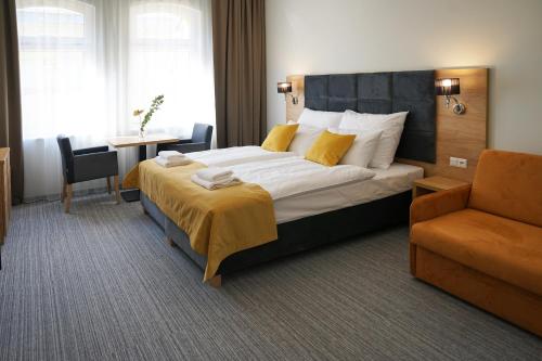 Posteľ alebo postele v izbe v ubytovaní FACTORY RESORT wellness & spa