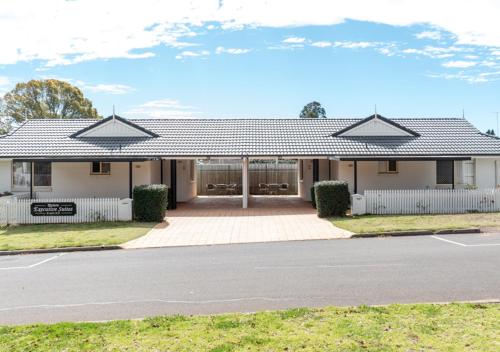 a house with a driveway in front of it at Riviera on Ruthven in Toowoomba