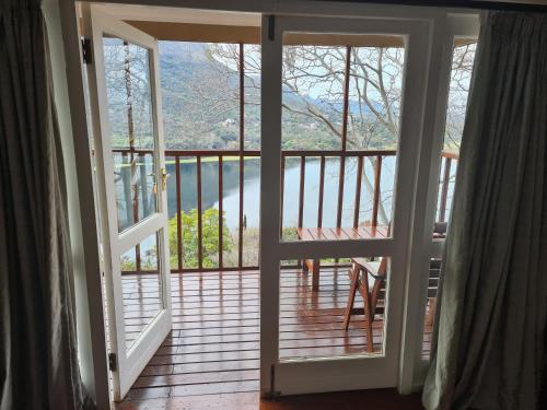 an open door to a balcony with a view at Letamong in Hartbeespoort