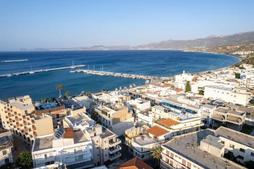 an aerial view of a town next to the ocean at Ni President Suite, DeMaNi President Suites in Sitia