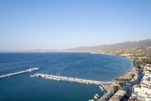an aerial view of a dock in the water at Ni President Suite, DeMaNi President Suites in Sitia