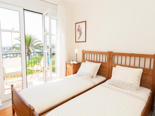 Postel nebo postele na pokoji v ubytování Bungalow Marina Deluxe