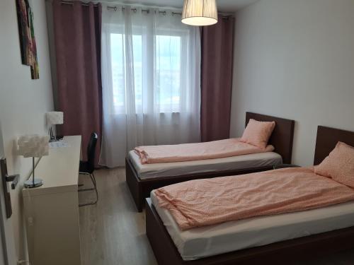 Posteľ alebo postele v izbe v ubytovaní Apartament na Lazurowej