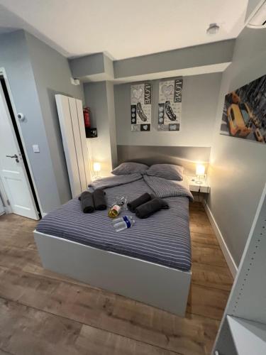 a bedroom with a large bed with blue sheets at City Center Studio Amsterdam in Amsterdam