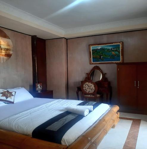 Ένα ή περισσότερα κρεβάτια σε δωμάτιο στο The Reinhold Guesthouse Bali