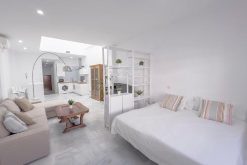 Postel nebo postele na pokoji v ubytování LOFT SÚPER LUMINOSO EN EL CENTRO DEL PUERTO DE SANTA MARÍA.