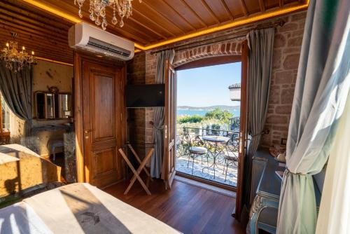 A bed or beds in a room at CUNDA BARADİEL Hotel