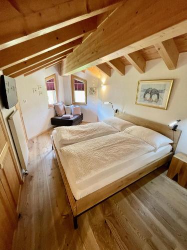 a bedroom with a large bed in a attic at Mischabelblick, Fiescheralp in Fiesch