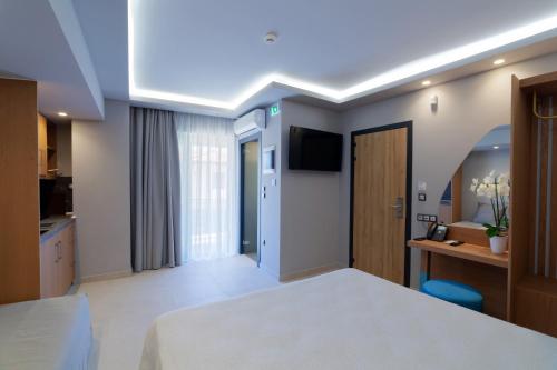 Katil atau katil-katil dalam bilik di Lithos Suites - Nikiti Halkidiki